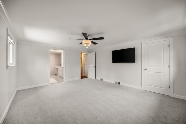 unfurnished bedroom featuring carpet floors, baseboards, and ornamental molding