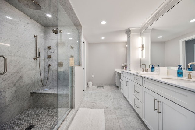 bathroom featuring double vanity, baseboards, marble finish floor, a shower stall, and a sink