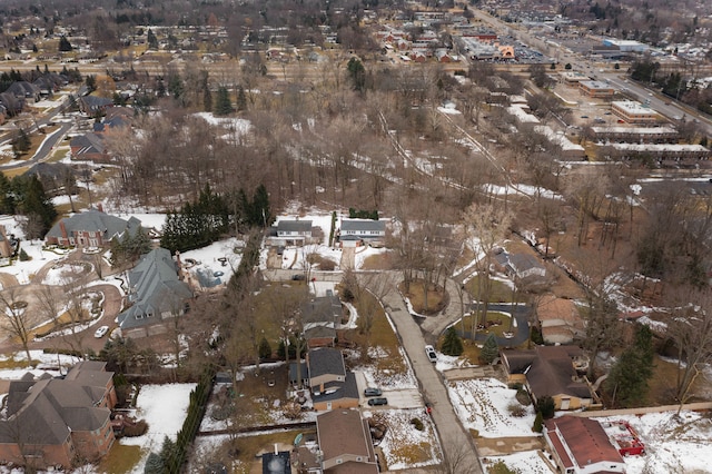 snowy aerial view featuring a residential view