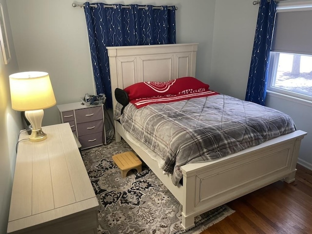 bedroom with wood finished floors