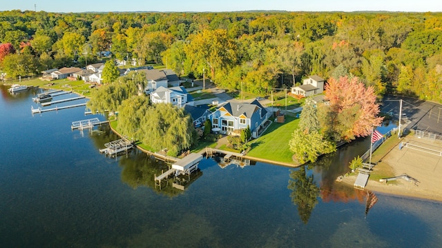 aerial view featuring a water view and a forest view