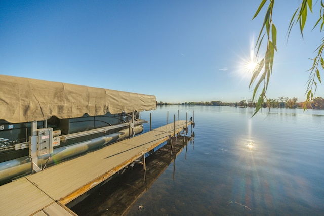 view of dock featuring a water view and boat lift