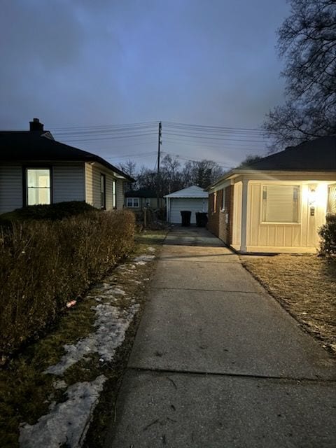 view of side of home with an outbuilding and a garage