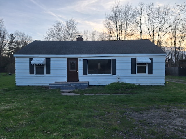 1471 Wadhams Rd, Kimball, MI 48074 - view of front facade featuring a chimney and a front yard