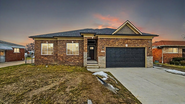 view of front facade featuring driveway, an attached garage, and brick siding