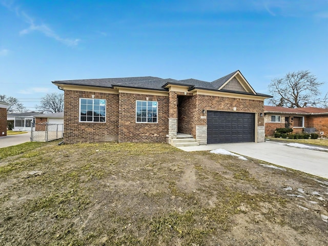 view of front of property featuring brick siding, roof with shingles, concrete driveway, an attached garage, and fence