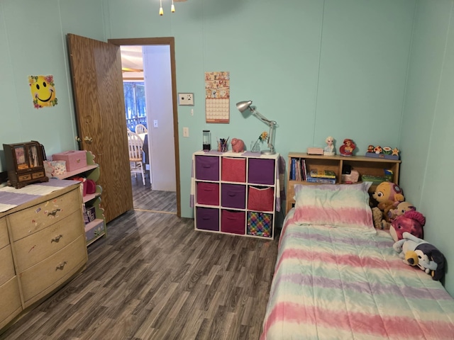 bedroom featuring wood finished floors