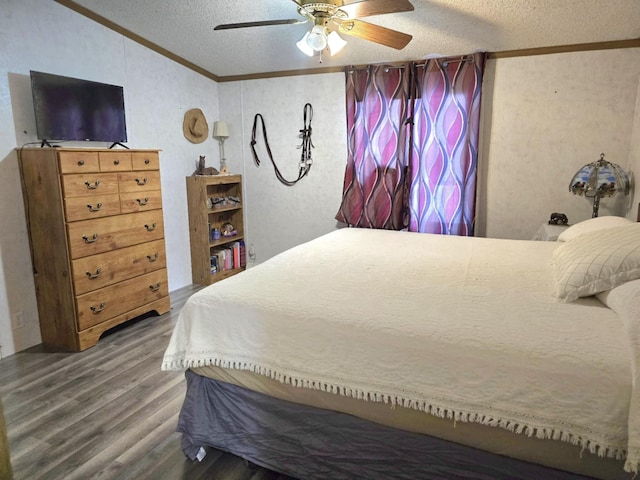 bedroom featuring crown molding, a textured ceiling, a ceiling fan, and wood finished floors