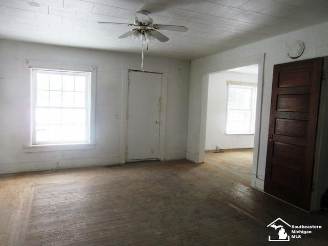 unfurnished room featuring a ceiling fan and wood finished floors