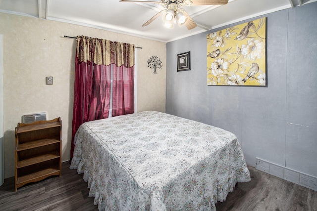 bedroom featuring ceiling fan, wood finished floors, and visible vents