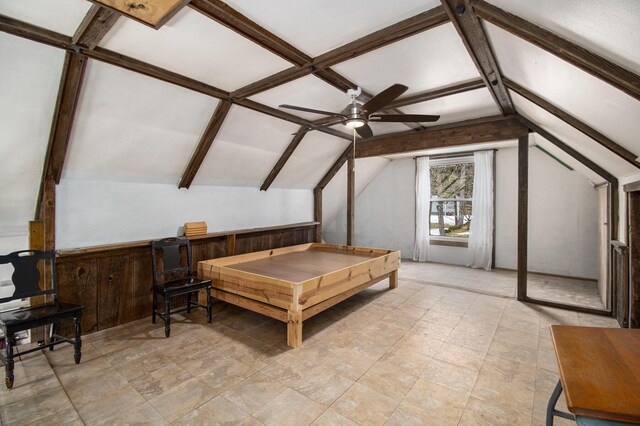 bedroom with vaulted ceiling with beams