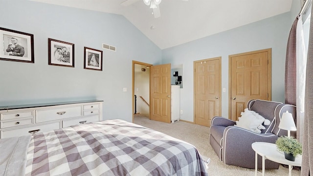 bedroom with light carpet, high vaulted ceiling, ceiling fan, and visible vents