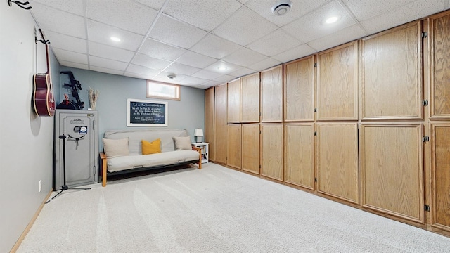 unfurnished room featuring a paneled ceiling, light carpet, and recessed lighting