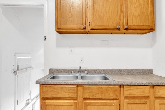 kitchen with light countertops and a sink