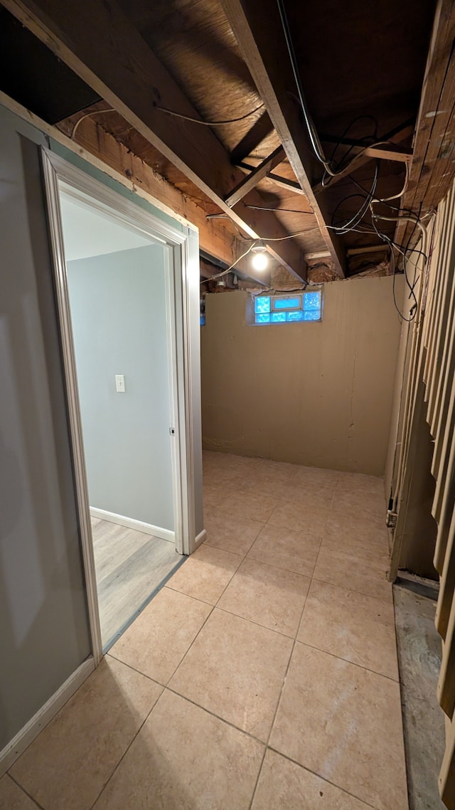 corridor featuring light tile patterned flooring