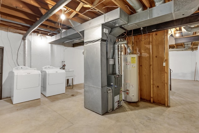 unfinished below grade area featuring gas water heater, a sink, heating unit, and separate washer and dryer