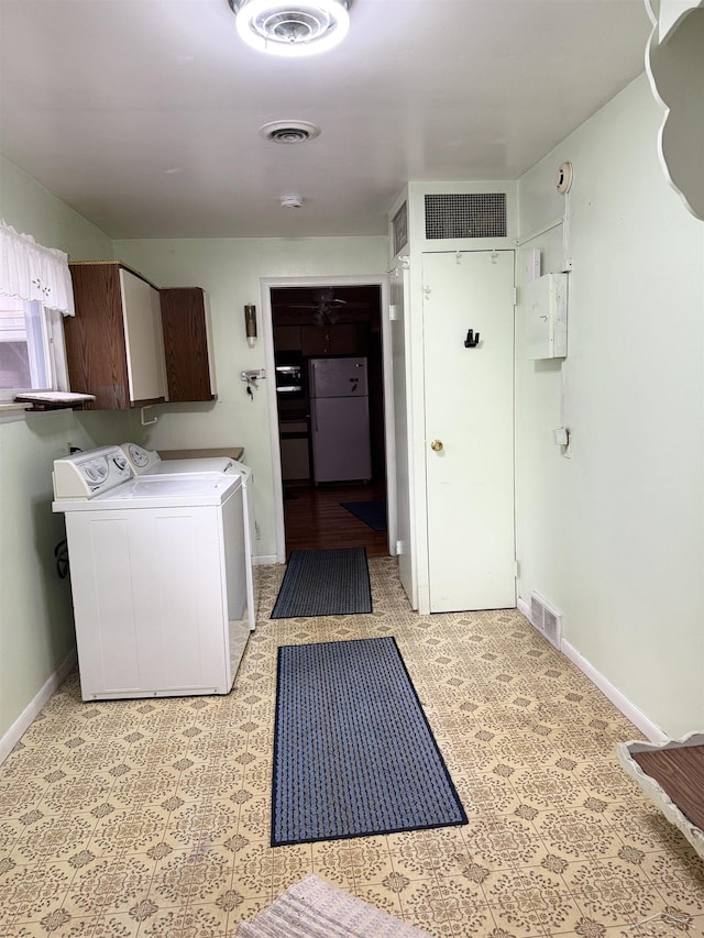 laundry room with cabinet space, visible vents, and independent washer and dryer