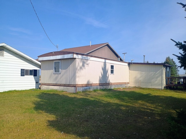 view of home's exterior with a lawn