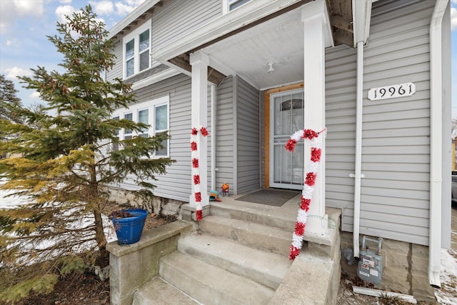 view of exterior entry featuring a porch