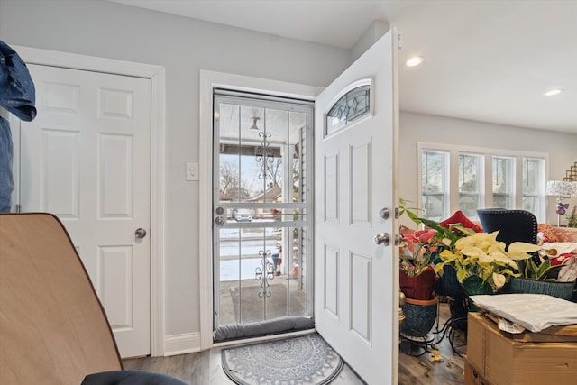 entryway with recessed lighting, baseboards, and wood finished floors