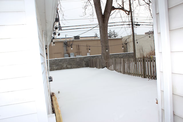 view of yard covered in snow