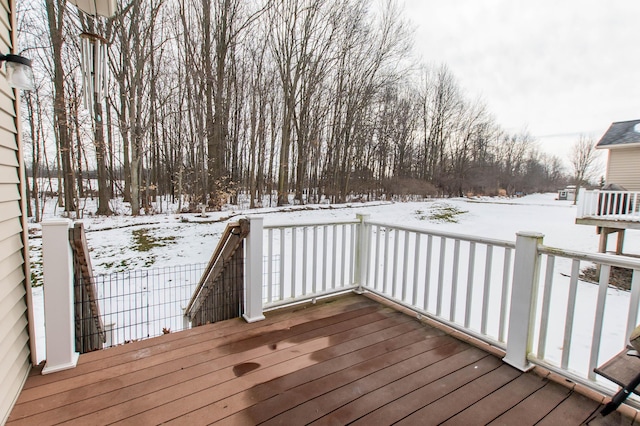 view of snow covered deck