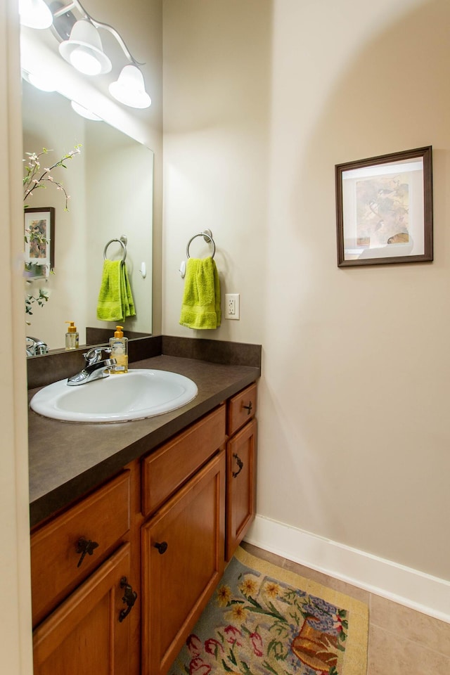 bathroom featuring vanity and baseboards