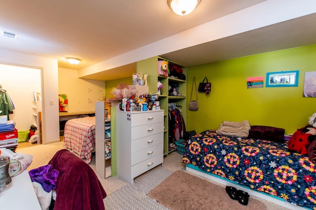 carpeted bedroom with visible vents