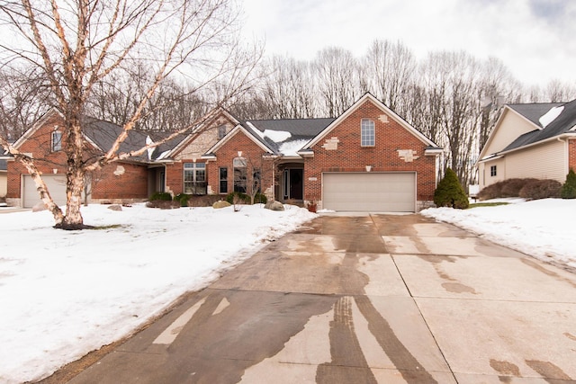 view of front of house with concrete driveway and brick siding