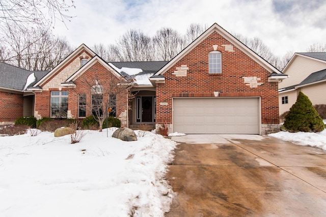 view of front facade with concrete driveway, brick siding, and an attached garage