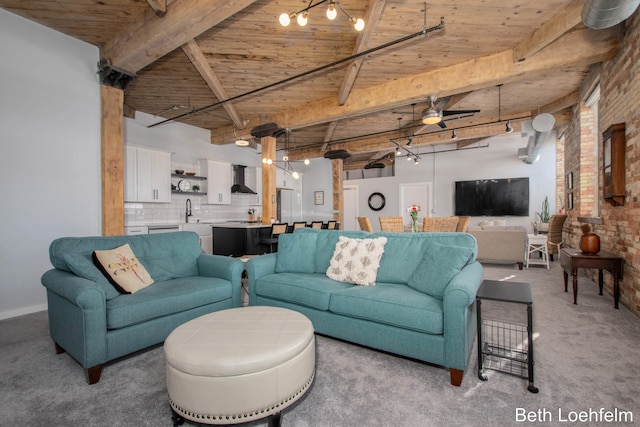 living room featuring brick wall, wood ceiling, light colored carpet, and beam ceiling