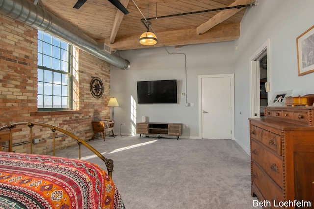 carpeted bedroom featuring a high ceiling, beamed ceiling, and wood ceiling