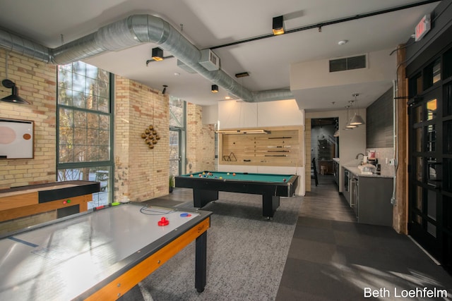 recreation room featuring brick wall, billiards, and visible vents