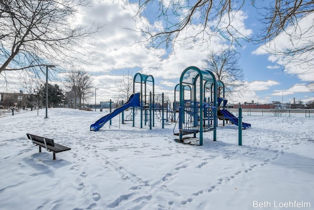 snow covered playground featuring playground community