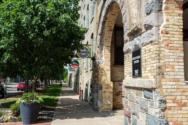 940 Monroe Ave NW # 461, Grand Rapids, MI 49503 - view of side of property featuring brick siding