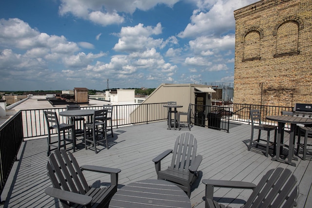 940 Monroe Ave NW # 461, Grand Rapids, MI 49503 - wooden terrace with outdoor dining area