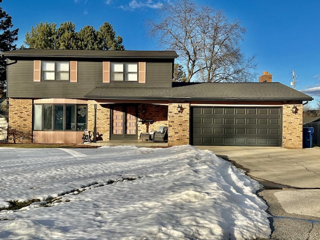 view of front of home featuring a porch, an attached garage, brick siding, concrete driveway, and a chimney