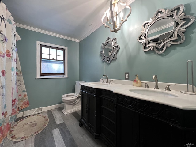 bathroom featuring ornamental molding, visible vents, a sink, and toilet