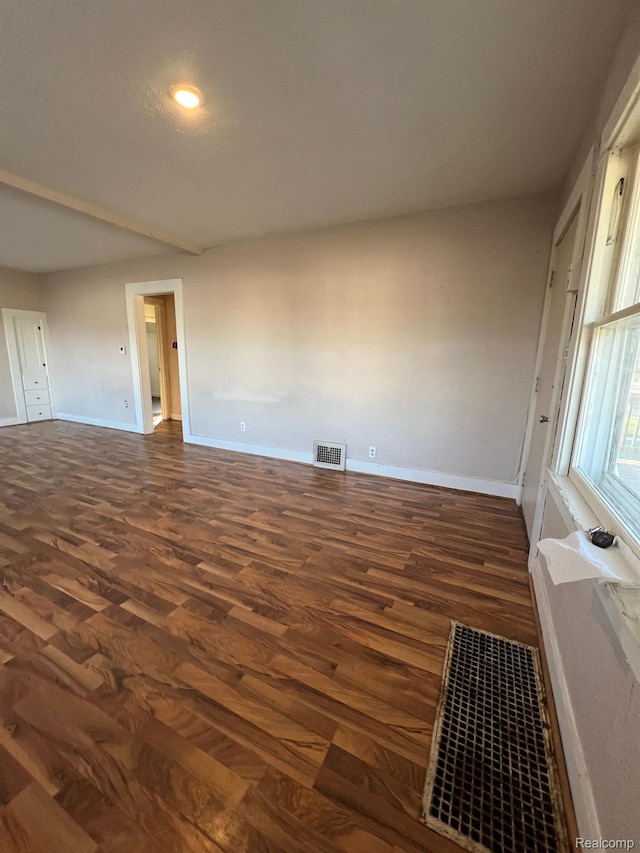 1517 Stanley St, Saginaw, MI 48602 - spare room with baseboards and dark wood-style floors