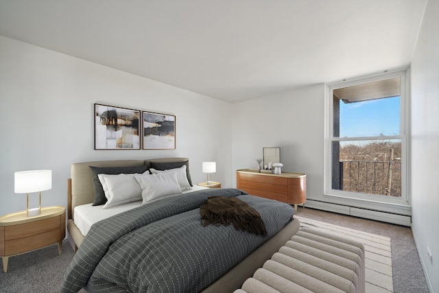bedroom with carpet and baseboard heating