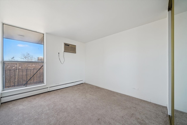 carpeted empty room with an AC wall unit and baseboard heating