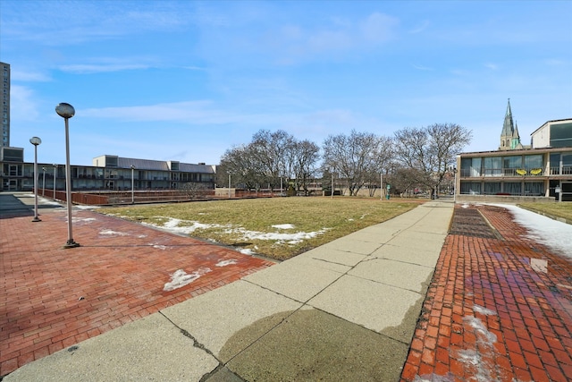 view of home's community with a yard