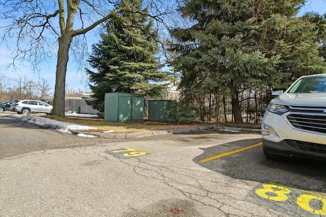 uncovered parking lot with fence