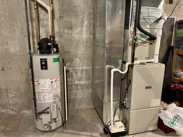 utility room featuring gas water heater and heating unit