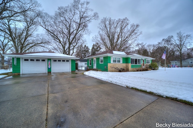 view of front of property with an outbuilding and a garage