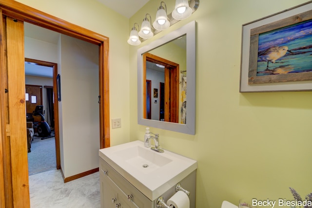 bathroom with vanity and baseboards