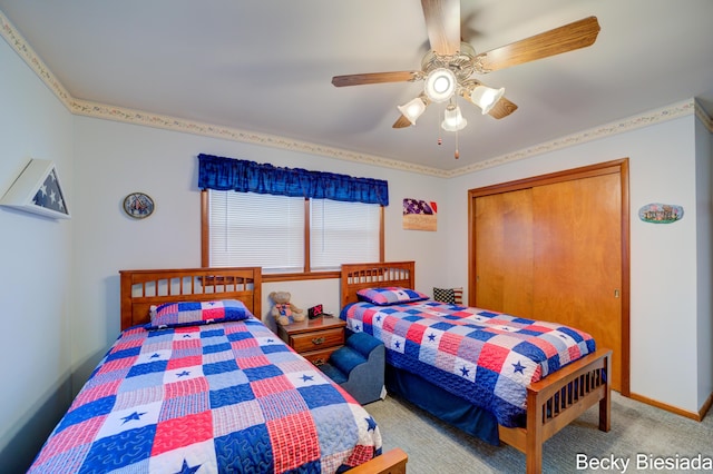 bedroom featuring a closet, light carpet, ceiling fan, and baseboards