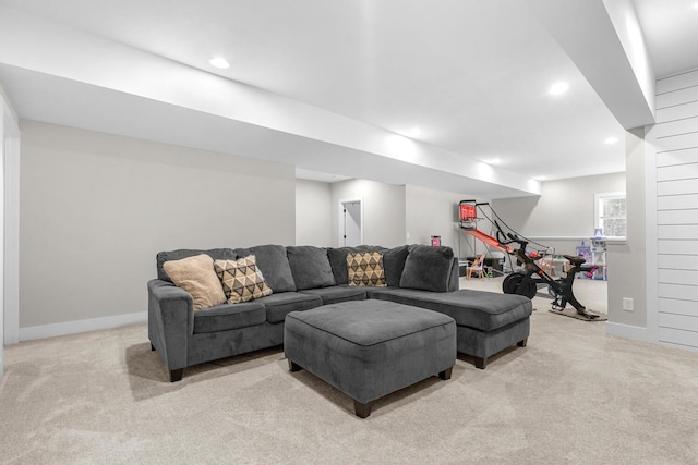 living room featuring recessed lighting, baseboards, and light colored carpet