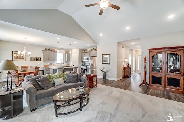 living area featuring recessed lighting, baseboards, and wood finished floors