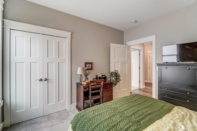 carpeted bedroom with a closet